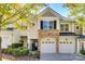 Two-story townhome with stone and siding exterior, double garage at 588 Pine Links Dr, Tega Cay, SC 29708