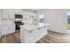 Modern kitchen with white cabinets, quartz countertops, and stainless steel appliances at 7906 Old Brook Rd, Sherrills Ford, NC 28673