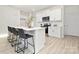 Bright and airy kitchen with white cabinetry, stainless steel appliances, and a center island at 8063 Plymouth Dr, Sherrills Ford, NC 28673