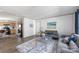 Open concept living room with gray sofas, coffee table and kitchen view at 229 Sailwinds Rd, Mooresville, NC 28115