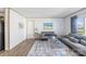 Living room with gray sofas, coffee table and area rug at 229 Sailwinds Rd, Mooresville, NC 28115