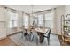 Bright dining room with hardwood floors and a rustic wood dining table at 312 S Turner Ave # 12, Charlotte, NC 28208