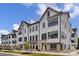 Modern townhome community with white exteriors and black accents at 312 S Turner Ave # 12, Charlotte, NC 28208