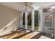 Screened porch with white shutters and ceiling fan at 45014 Wigeon Ln # 100, Indian Land, SC 29707