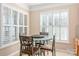 Bright breakfast nook features a mosaic table and four chairs, perfect for casual dining at 45014 Wigeon Ln # 100, Indian Land, SC 29707