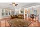 Spacious living room with hardwood floors, large windows and comfortable seating at 45014 Wigeon Ln # 100, Indian Land, SC 29707