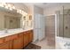 Double vanity bathroom with a large shower and separate tub at 45014 Wigeon Ln # 100, Indian Land, SC 29707