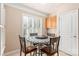 Charming breakfast nook with mosaic table, four chairs, and adjacent kitchen access at 45014 Wigeon Ln # 100, Indian Land, SC 29707
