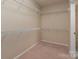 Large walk-in closet with wire shelving at 45014 Wigeon Ln # 100, Indian Land, SC 29707