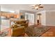 Open living room showcasing hardwood floors and access to kitchen at 45014 Wigeon Ln # 100, Indian Land, SC 29707