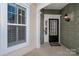 Inviting front entrance with a charming door and well-maintained porch at 45014 Wigeon Ln # 100, Indian Land, SC 29707