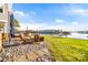 Seating area on a stone patio overlooking the water at 116 Sisters Cove Ct, Mooresville, NC 28117