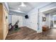 Basement home gym with wood flooring and barn doors at 116 Sisters Cove Ct, Mooresville, NC 28117