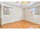 Simple bedroom featuring hardwood floors and window coverings at 2320 Mcgill St, Kannapolis, NC 28081