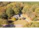 Aerial view of a house on a wooded lot with a long driveway at 4677 Ramsey Rd, Sharon, SC 29742