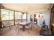 Screened porch with table, chairs, and access to kitchen at 1111 & 1075 Turkey Creek Ridge Rd, York, SC 29745