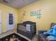 Adorable Bedroom with crib, seating and giraffe theme at 11741 Blessington Rd, Huntersville, NC 28078