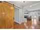 Bright entryway with a rustic barn door leading to the living area at 4660 Gold Finch Dr, Denver, NC 28037