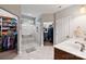 Spa-like bathroom with a walk-in shower, double vanity, and ample storage at 4660 Gold Finch Dr, Denver, NC 28037