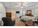 Main bedroom with a large bed, a ceiling fan, and access to the bathroom at 4660 Gold Finch Dr, Denver, NC 28037