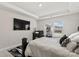 Elegant bedroom with a large TV and stylish decor at 6864 Good News Dr, Charlotte, NC 28215