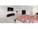 Main bedroom with large TV, dresser, and bed at 7805 Stonehouse Dr, Gastonia, NC 28056