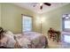 Bedroom featuring a floral bedding and a writing desk at 220 6Th St, Belmont, NC 28012