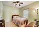 Light and airy bedroom with floral bedding and ceiling fan at 220 6Th St, Belmont, NC 28012