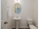 Convenient powder room with pedestal sink and toilet at 3057 Burnello Ct, Iron Station, NC 28080
