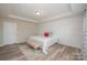 Main bedroom with stylish geometric wall and ensuite access at 3057 Burnello Ct, Iron Station, NC 28080