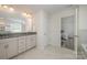 Bathroom with double sinks, granite countertop, and access to bedroom at 3057 Burnello Ct, Iron Station, NC 28080