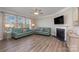 Living room with fireplace, hardwood floors, and plenty of natural light at 3057 Burnello Ct, Iron Station, NC 28080