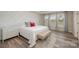 Spacious primary bedroom with a neutral color scheme and an accent wall at 3057 Burnello Ct, Iron Station, NC 28080