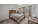 Bright bedroom with wood flooring, a double door closet, and a workspace at 3057 Burnello Ct, Iron Station, NC 28080