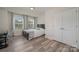 Cozy bedroom with wood flooring, a desk, and a large closet at 3057 Burnello Ct, Iron Station, NC 28080