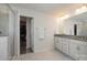 Double vanity bathroom with granite countertop and walk-in shower at 3057 Burnello Ct, Iron Station, NC 28080