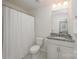Clean bathroom with granite countertop vanity and shower/tub combo at 3057 Burnello Ct, Iron Station, NC 28080