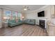 Living room features hardwood floors, fireplace, and neutral decor at 3057 Burnello Ct, Iron Station, NC 28080