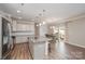 Eat-in kitchen with island and access to backyard at 3057 Burnello Ct, Iron Station, NC 28080
