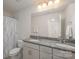 Main bathroom with double vanity and shower/tub combo at 3057 Burnello Ct, Iron Station, NC 28080