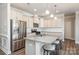Stainless steel appliances and granite countertops in this kitchen at 3057 Burnello Ct, Iron Station, NC 28080