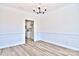 Formal dining room with wainscoting and hardwood floors at 201 Wedge View Way, Statesville, NC 28677