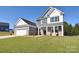 Two-story home with gray and white siding, two-car garage at 201 Wedge View Way, Statesville, NC 28677