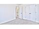 Bedroom with carpet, neutral walls, and double closet at 201 Wedge View Way, Statesville, NC 28677