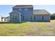 Home's backyard with grass and patio at 201 Wedge View Way, Statesville, NC 28677