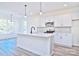 Modern kitchen with white cabinets and quartz countertops at 201 Wedge View Way, Statesville, NC 28677