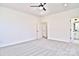 Spacious bedroom with ceiling fan and access to bathroom at 201 Wedge View Way, Statesville, NC 28677