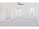 Bright bedroom with ceiling fan and walk-in closet at 201 Wedge View Way, Statesville, NC 28677