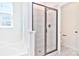 Modern bathroom with walk-in shower and gray tile at 201 Wedge View Way, Statesville, NC 28677