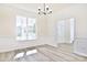 Formal dining room with wainscoting and hardwood floors at 201 Wedge View Way, Statesville, NC 28677
